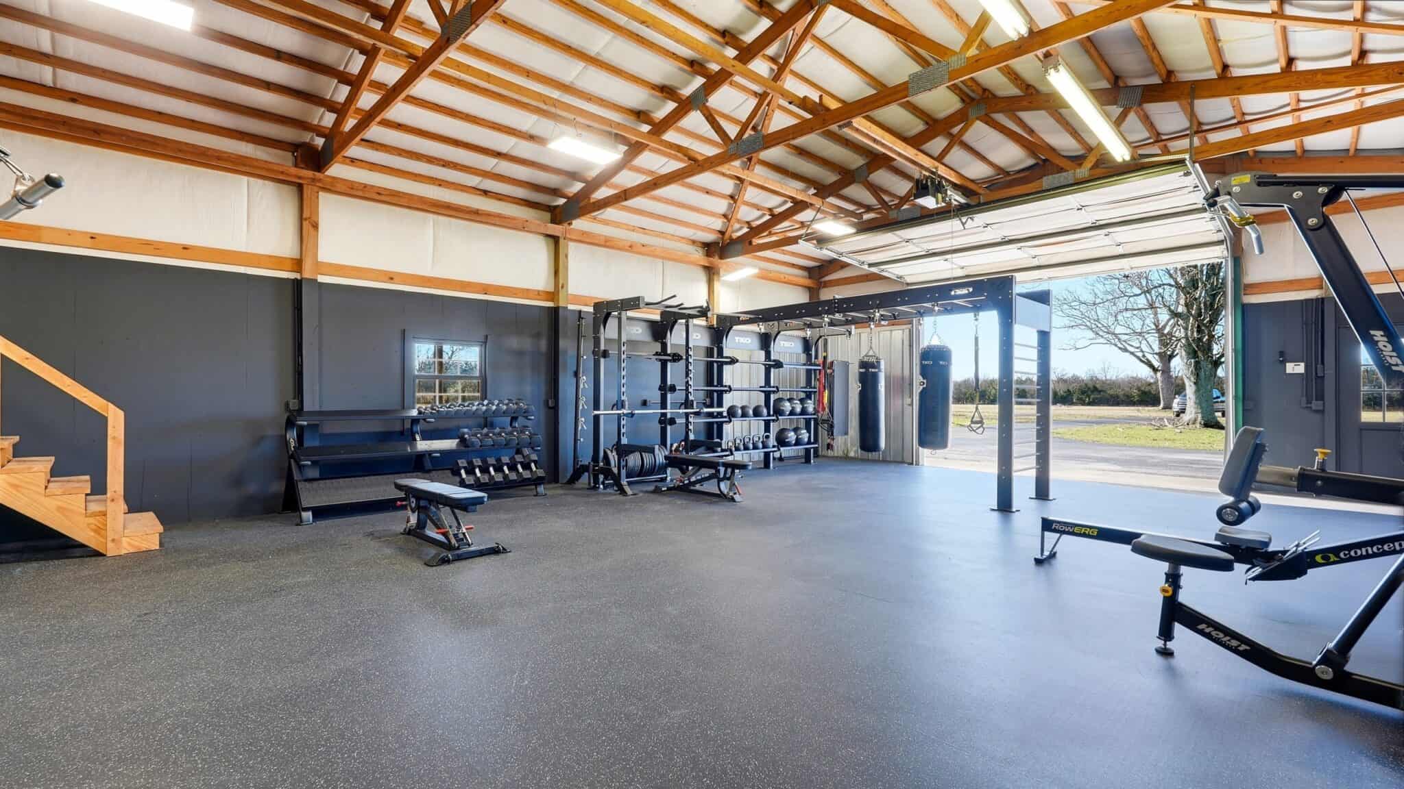 Spacious gym interior with workout equipment at pH Wellness.